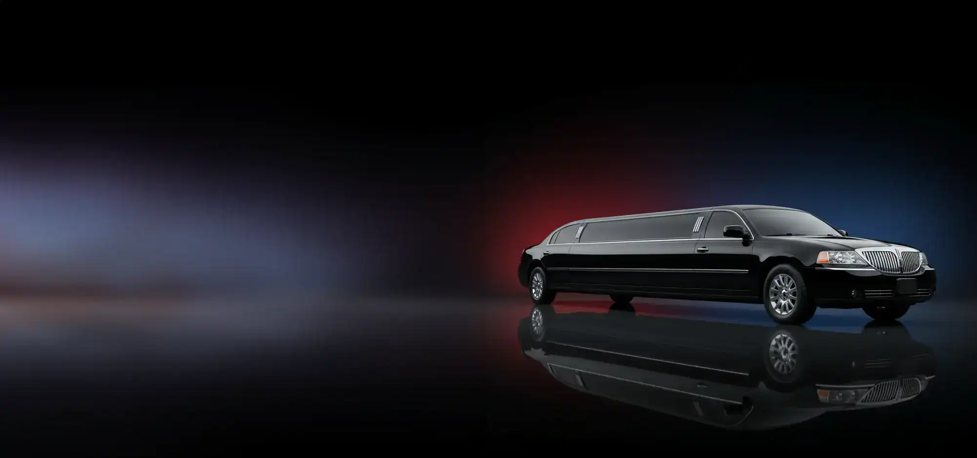 A black stretch limousine with tinted windows is parked on a reflective surface, set against a dark background with subtle red and blue gradients—perfect for those seeking premium Limo Service New Jersey.