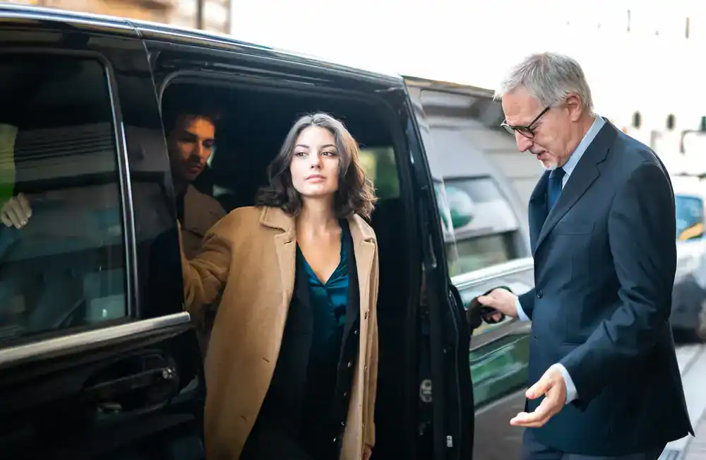 Businesswoman stepping out of a car in Mercer County, New Jersey, dressed professionally for work